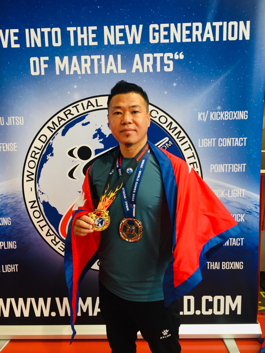 Sanjeet Kumar Rai as President of Nepal Wuma Kung Fu Association, holding a gold medal in Wuma Kung Fu